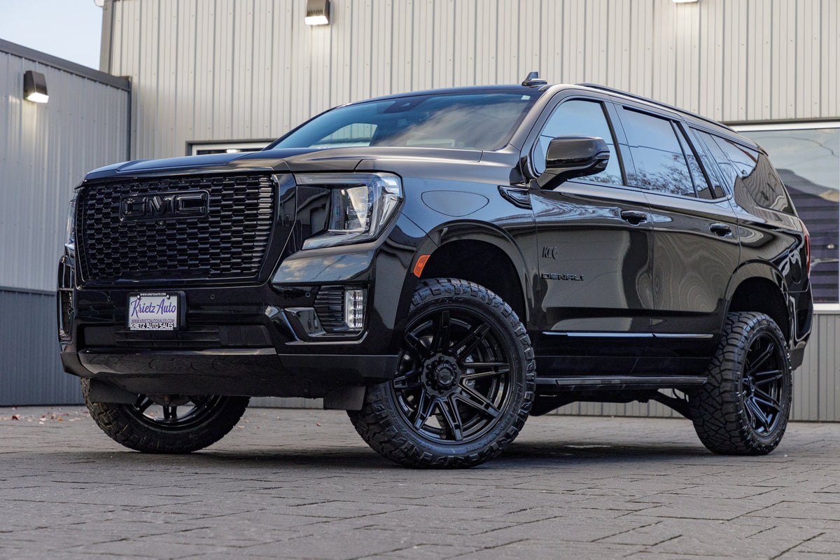 2023 GMC Yukon Denali with a 3" ReadyLift lift kit, 22x10 Fuel Brawl wheels, and 295/50 Nitto Ridge Grappler tires.