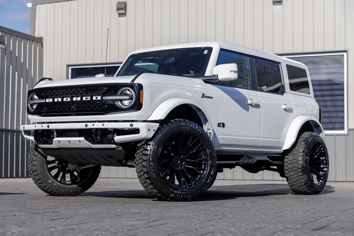 2024 Ford Bronco Wildtrak with a 2.25" Zone lift kit, 22x12 Fuel Rebar wheels, and 35" Fury Country Hunter R/T tires.
