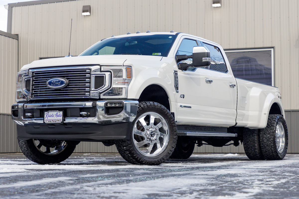 Ford F-350 Super Duty XLT with Ford Stock suspension, 20x10 Fuel Contra wheels, and 33" Nitto Ridge Grappler tires.