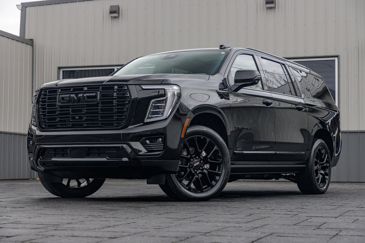 2025 GMC Yukon XL Denali with GMC Factory suspension, 22x9 GMC Stock wheels, and Bridgestone Alenza tires.