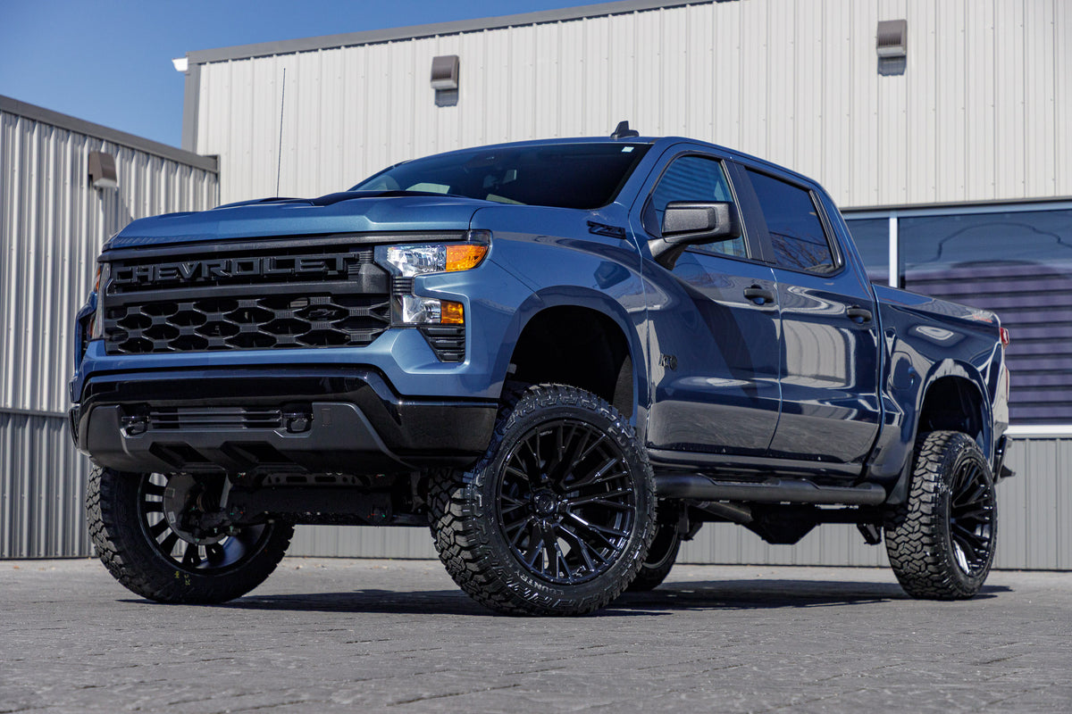 2024 Chevrolet Silverado 1500 Custom Trail Boss with a 6" Rough Country lift kit, 22x12 Fuel Rebar wheels, and 35" Fury Country Hunter R/T tires.