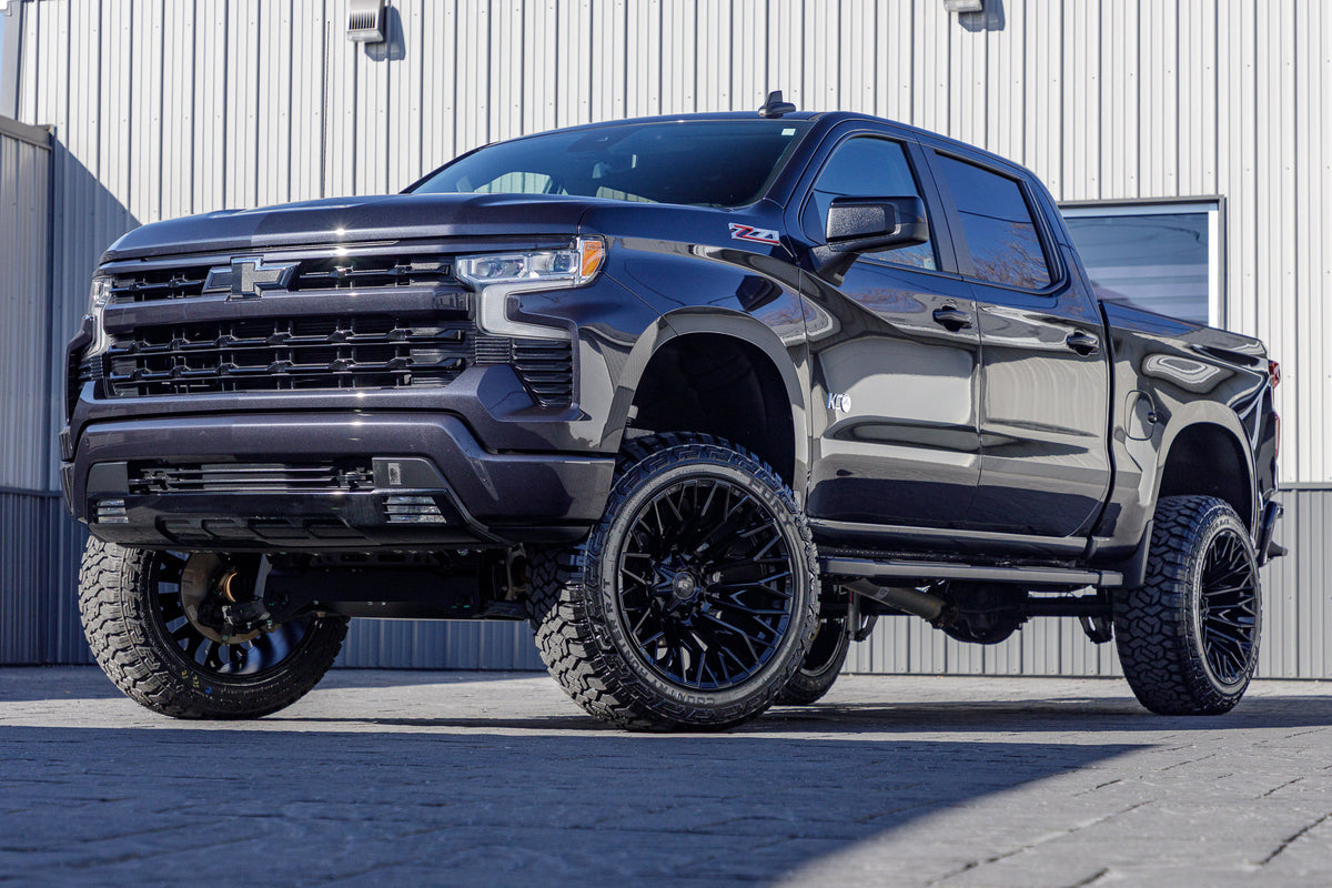 2023 Chevrolet Silverado 1500 RST with a 6" Rough Country lift kit, 22x12 Fuel Strike wheels, and 35" Fury Country Hunter R/T tires.