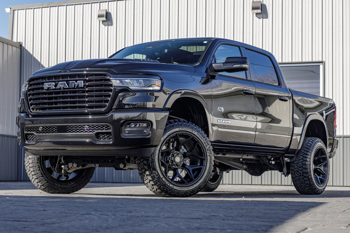2025 Ram 1500 Laramie with a 6" Rough Country lift kit, 22x12 4 Play 4P06 wheels, and 35" Fury Country Hunter R/T tires.