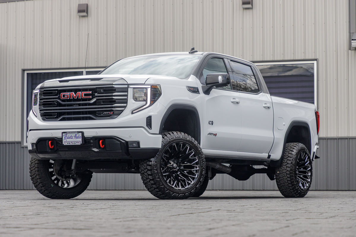 2024 GMC Sierra 1500 AT4 with a 6" Rough Country lift kit, 22x12 Fuel Strike wheels, and 35" Fury Country Hunter R/T tires.