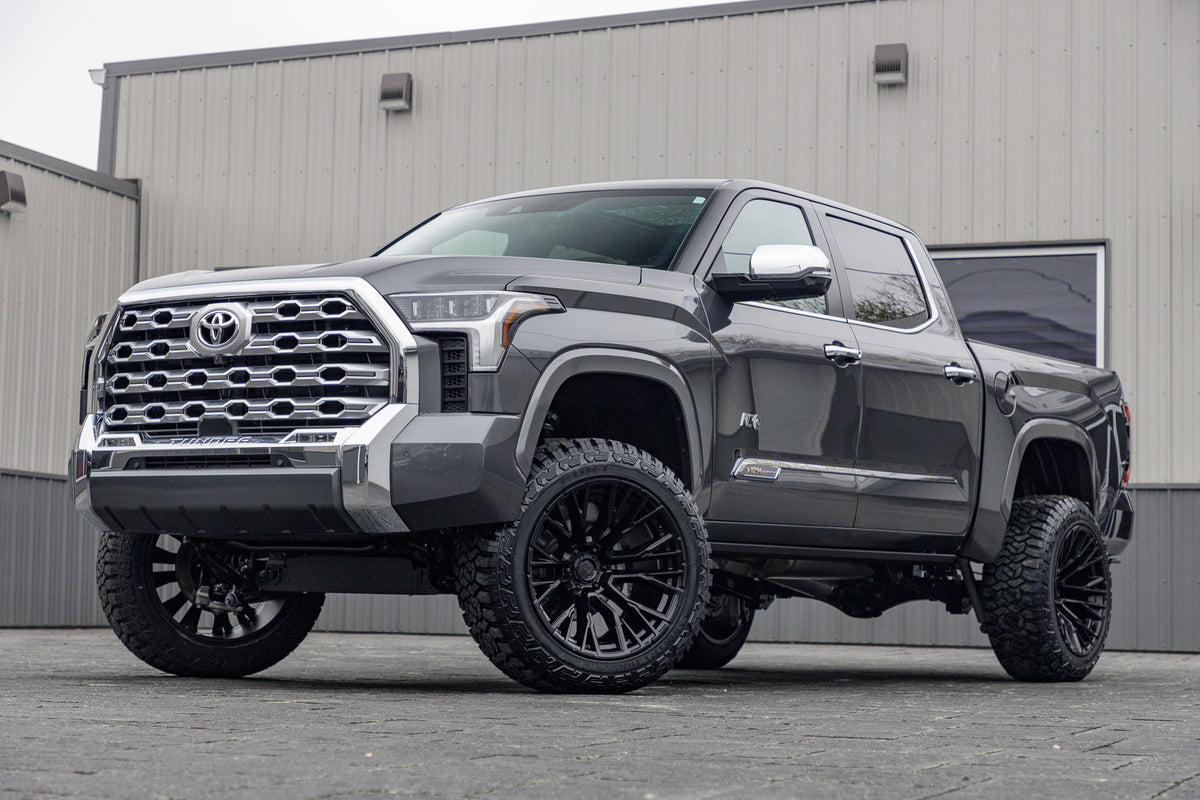 2025 Toyota Tundra Platinum with a 6" Rough Country lift kit, 22x12 Fuel Rebar wheels, and 35" Fury Country Hunter R/T tires.