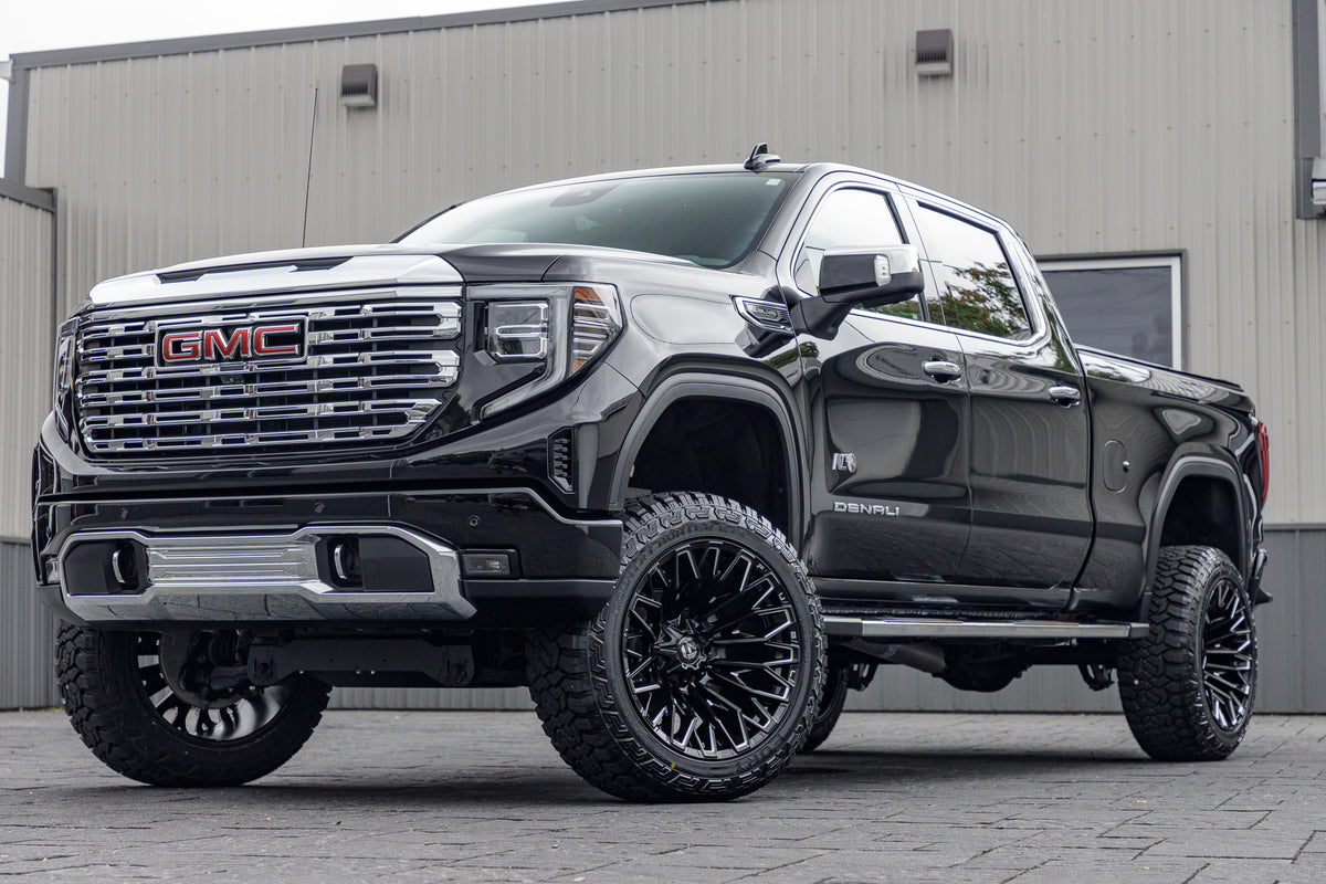 2022 GMC Sierra 1500 Denali with a 6" Rough Country suspension kit, 22x12 Fuel Strike wheels, and 35" Fury Country Hunter R/T tires.