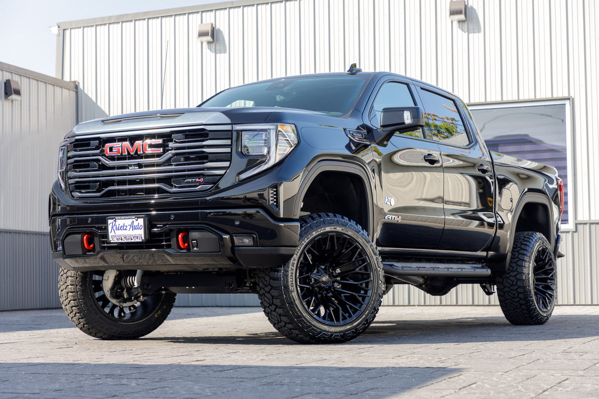 2024 GMC Sierra AT4 with a 6" Rough Country lift kit, 22x12 Fuel Strike wheels, and 35" Fury Country Hunter R/T tires.