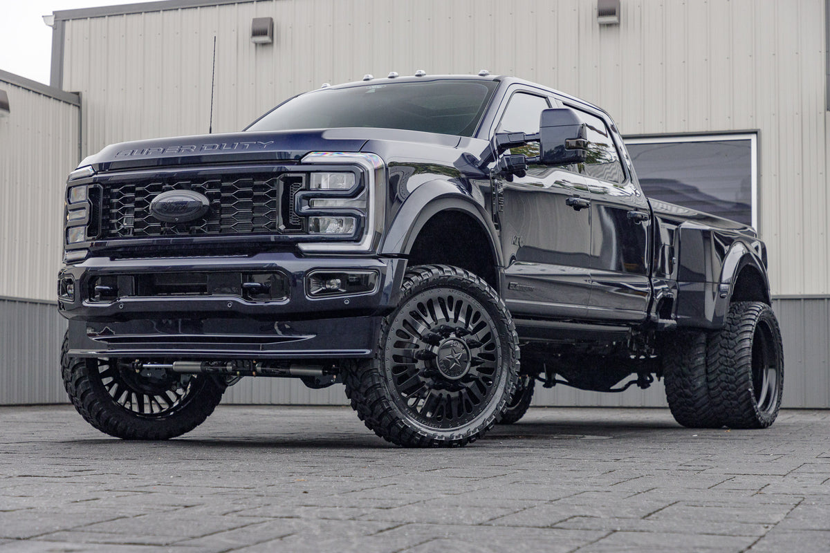 2024 Ford F-450 Super Duty with a 4" Wicked lift kit, 26x8.25 American Force Brawn wheels, and 37" Fury Country Hunter M/T tires.