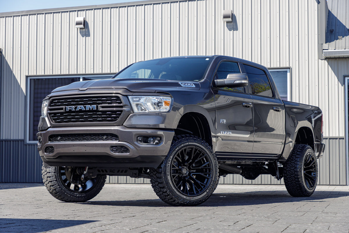 2022 Ram 1500 Lone Star with a 6" Rough Country lift kit, 22x12 Fuel Rebar wheels, and 35" Fury Country Hunter R/T tires.