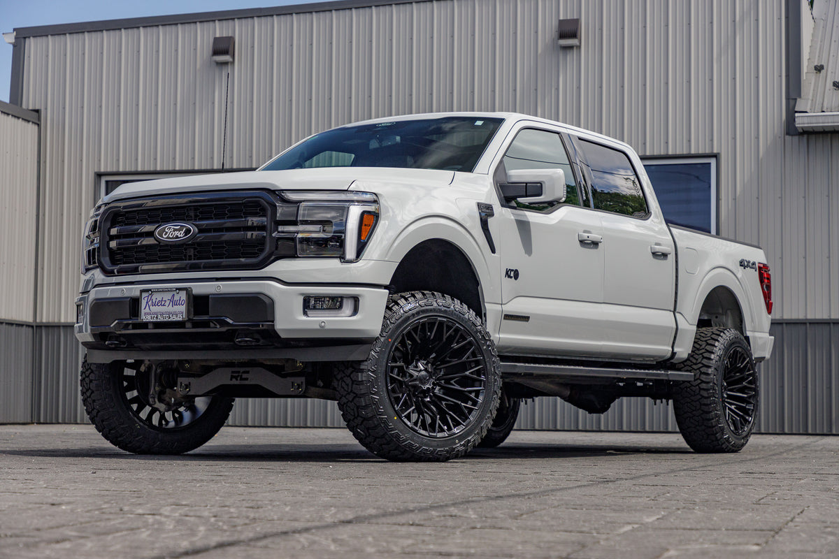 2024 Ford F-150 Lariat with a 6" Rough Country lift kit, 22x12 Fuel Strike wheels, and 35" Fury Country Hunter R/T tires.