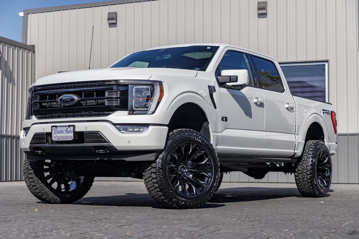 2023 Ford F-150 XLT with a 6" Rough Country lift kit, 22x12 Fuel Flame wheels, and 35" Fury Country Hunter R/T tires.