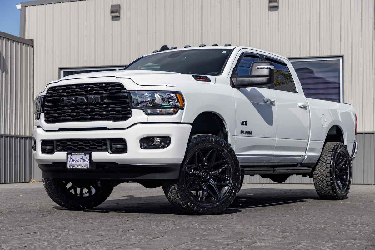 2023 Ram 2500 Big Horn with a 2.5" Rough Country leveling kit, 22x10 Fuel Flux wheels, and 35" Nitto Ridge Grappler tires.