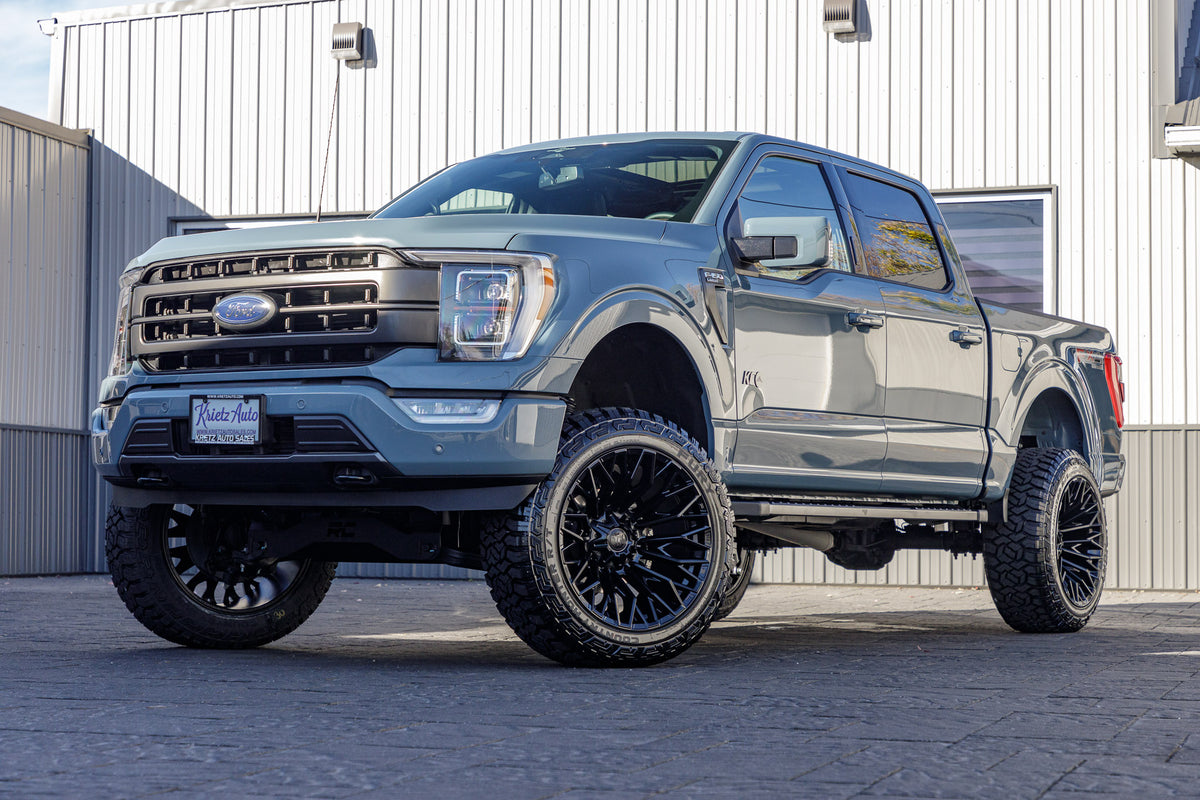 2023 Ford F-150 XLT with a 6" Rough Country lift kit, 22x12 Fuel Strike wheels, and 35" Fury Country Hunter R/T tires.
