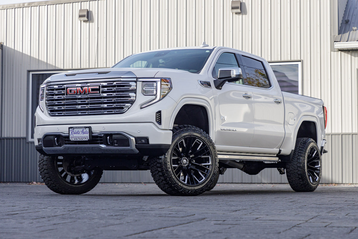 2023 GMC Sierra 1500 Denali with a 6" Rough Country suspension kit, 22x12 Fuel Rebar wheels, and 35" Fury Country Hunter R/T tires.