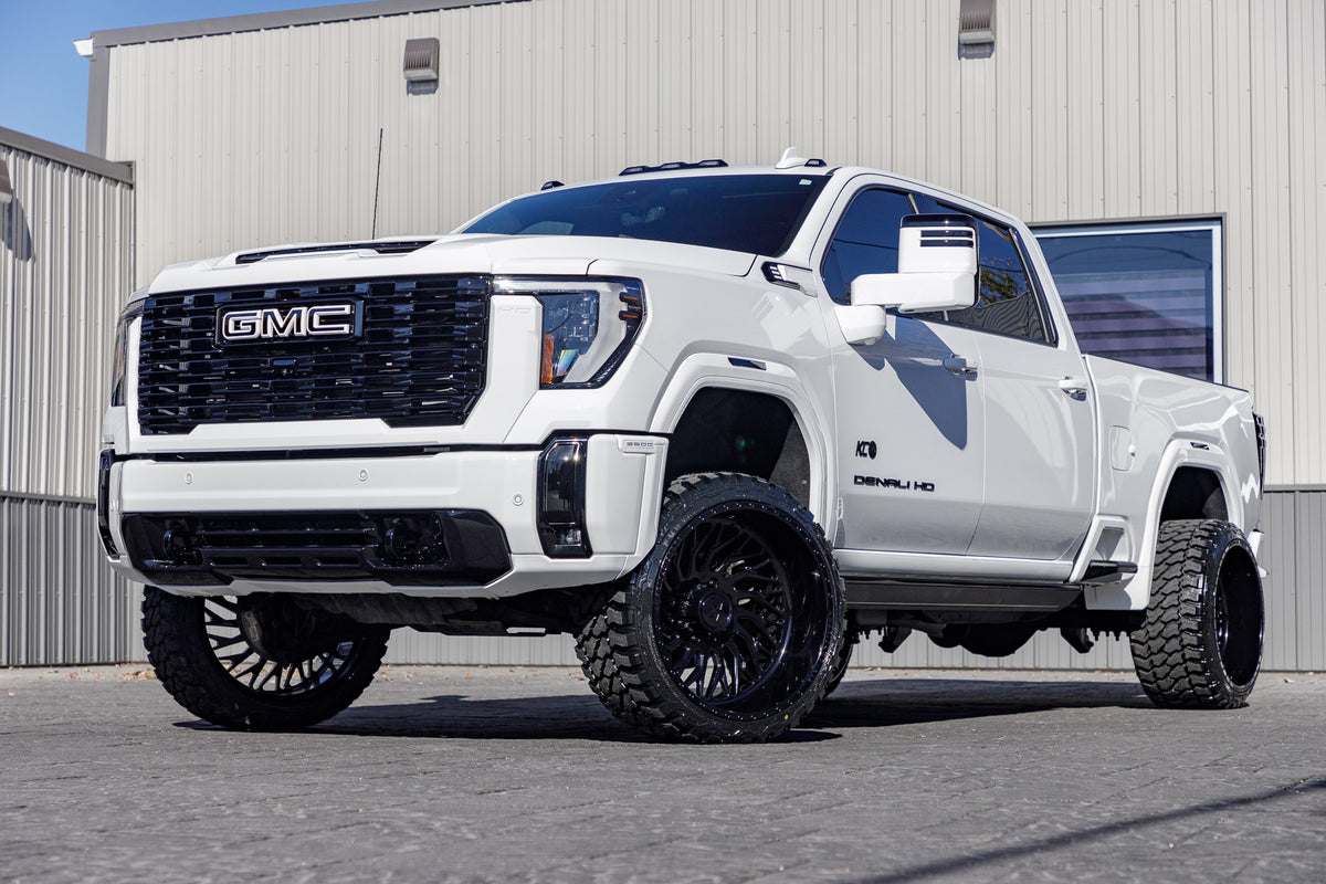 2024 GMC Sierra 3500 Denali Ultimate with a 3" Cognito Leveling kit, 24x14 American Force Swang wheels, and 33" Fury Country Hunter M/T tires.