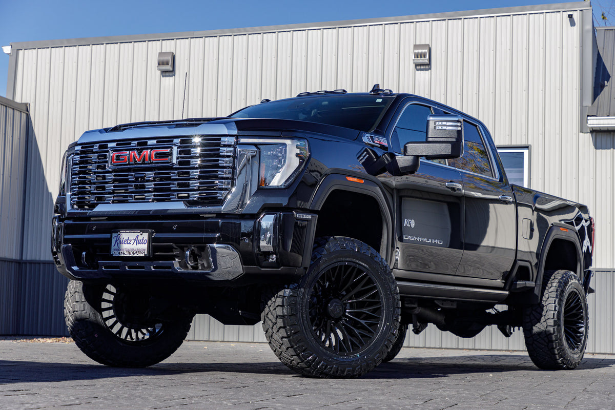 2024 GMC Sierra 1500 Denali with a 5" BDS lift kit, 22x12 TIS 566B wheels, and 37" Nitto Ridge Grappler tires.