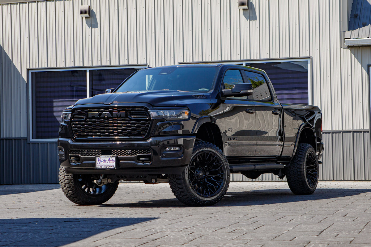 2025 Ram 1500 Big Horn with a 6" Rough Country lift kit, 22x12 Fuel Strike wheels, and 35" Fury Country Hunter R/T tires.