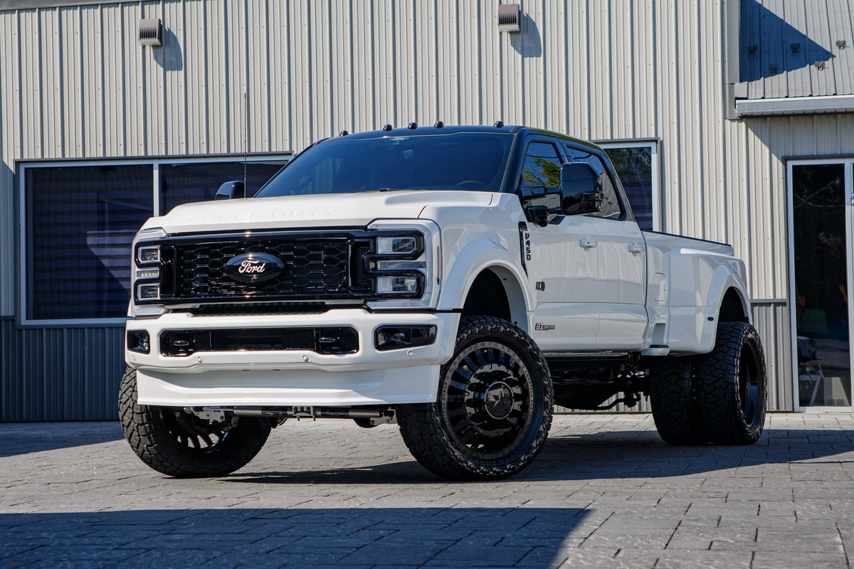 2026 Ford F-450 Platinum with a 4" Wicked lift kit, 24x8.25 American Force Doom wheels, and 37" Toyo Open Country R/T Trail tires.