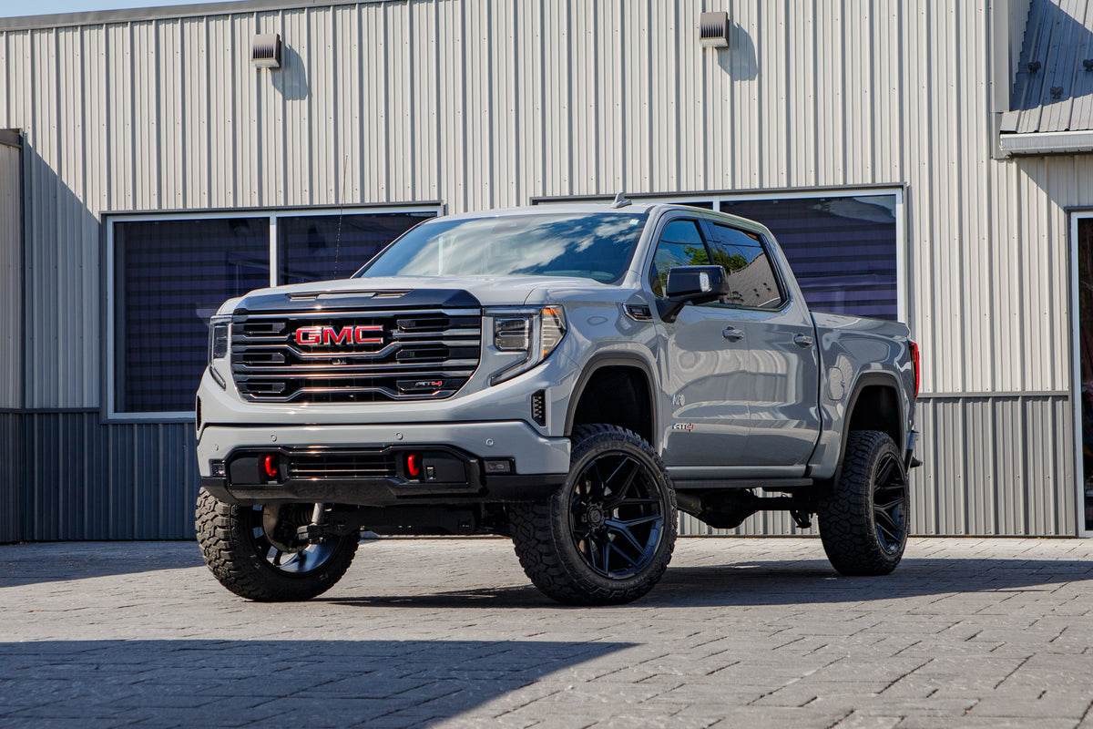 2025 GMC Sierra 1500 AT4 with a 6" Rough Country lift kit, 22x12 Fuel Flux wheels, and 35" Fury Country Hunter R/T tires.