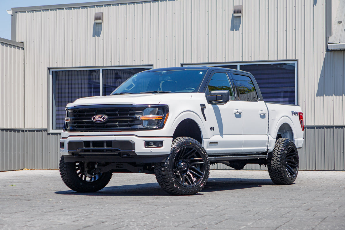2024 Ford F-150 XLT with a 6" Rough Country lift kit, 22x12 Fuel Typhoon wheels, and 35" Fury Country Hunter R/T tires.