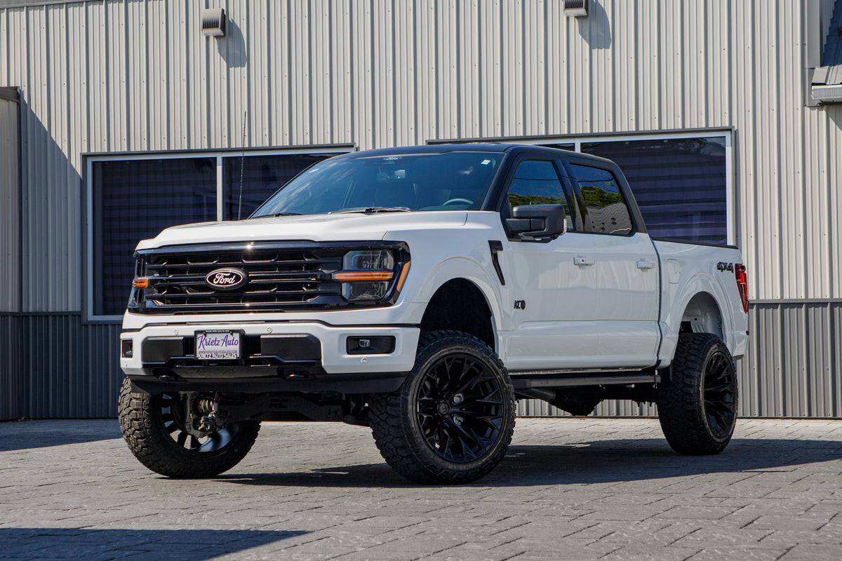 2025 Ford F-150 XLT with a 6" Rough Country lift kit, 22x12 Fuel Flame wheels, and 35" Fury Country Hunter R/T tires.
