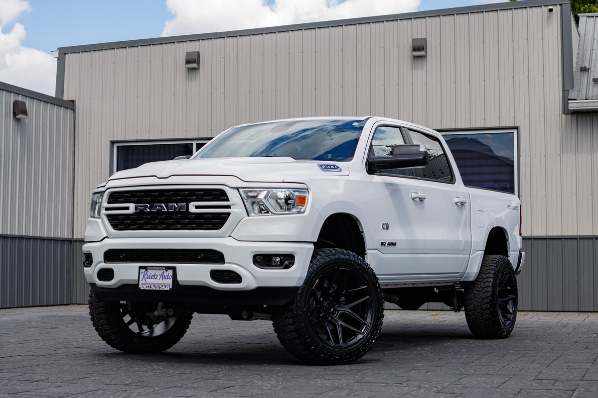 2022 Ram 1500 Big Horn with a 6" Rough Country lift kit, 22x12 Fuel Flux wheels, and 35" Avix Trailtek R/T tires.