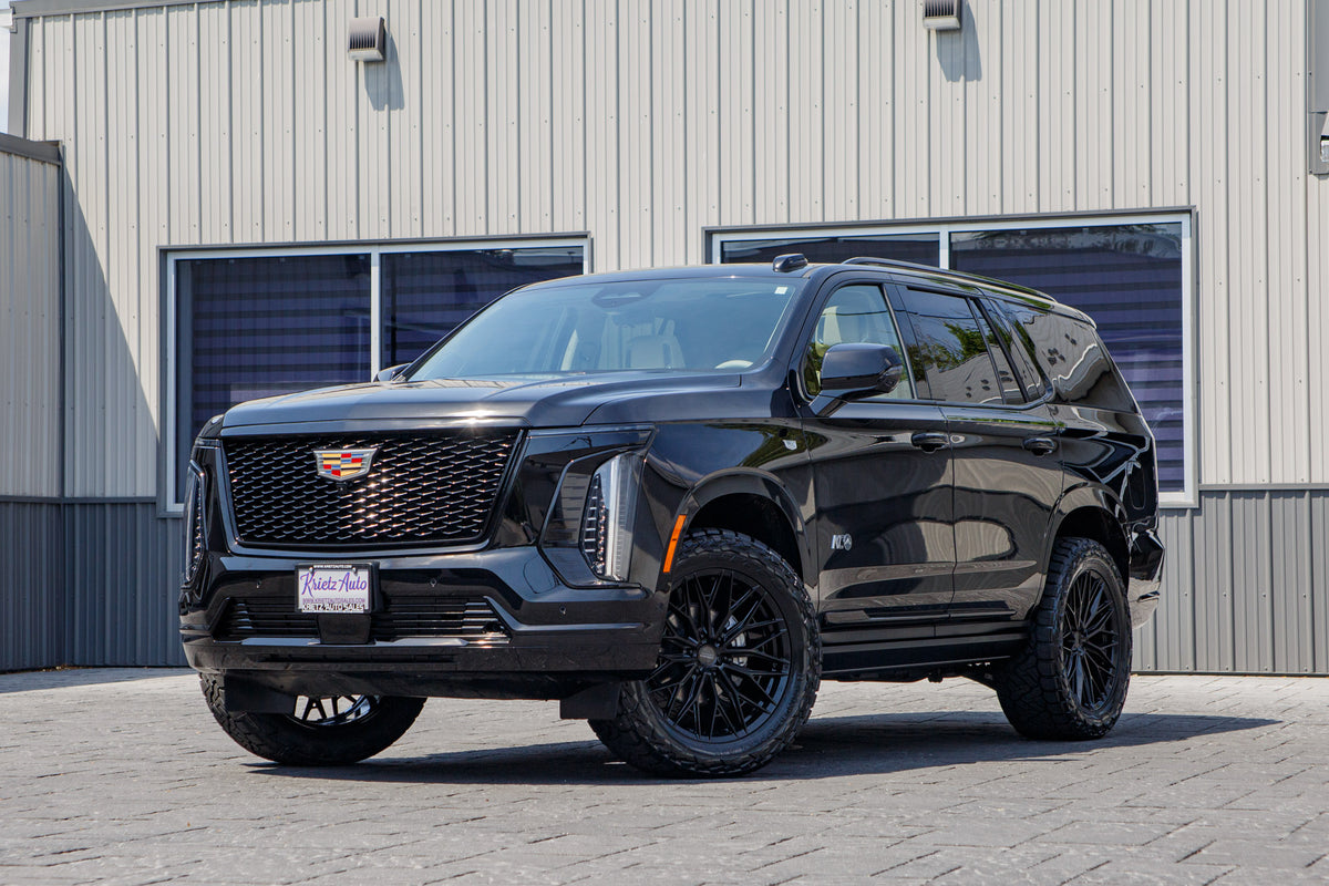 2026 Cadillac Escalade Platinum Sport with a 2" Rough Country lift kit, 22x9.5 Vossen HFX6 wheels, and 35" Nitto Recon Grappler tires.