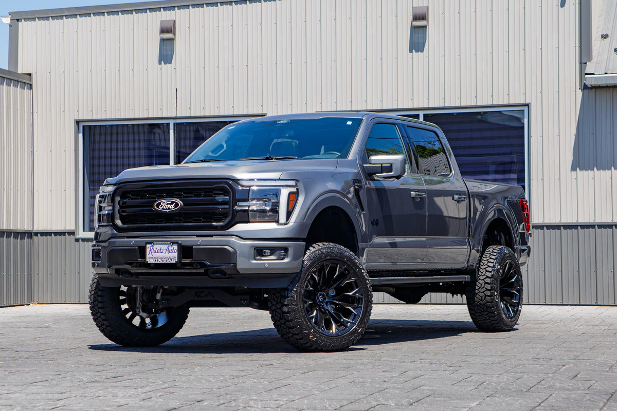 2025 Ford F-150 Lariat with a 6" Rough Country lift kit, 22x12 Fuel Flame wheels, and 35" Fury Country Hunter R/T tires.