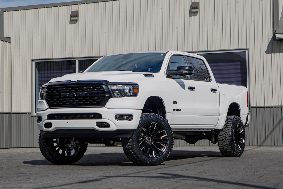 2023 Ram 1500 Lone Star with a 6" Rough Country lift kit, 22x12 Fuel Rebar wheels, and 35" Avix Trailtek R/T tires.