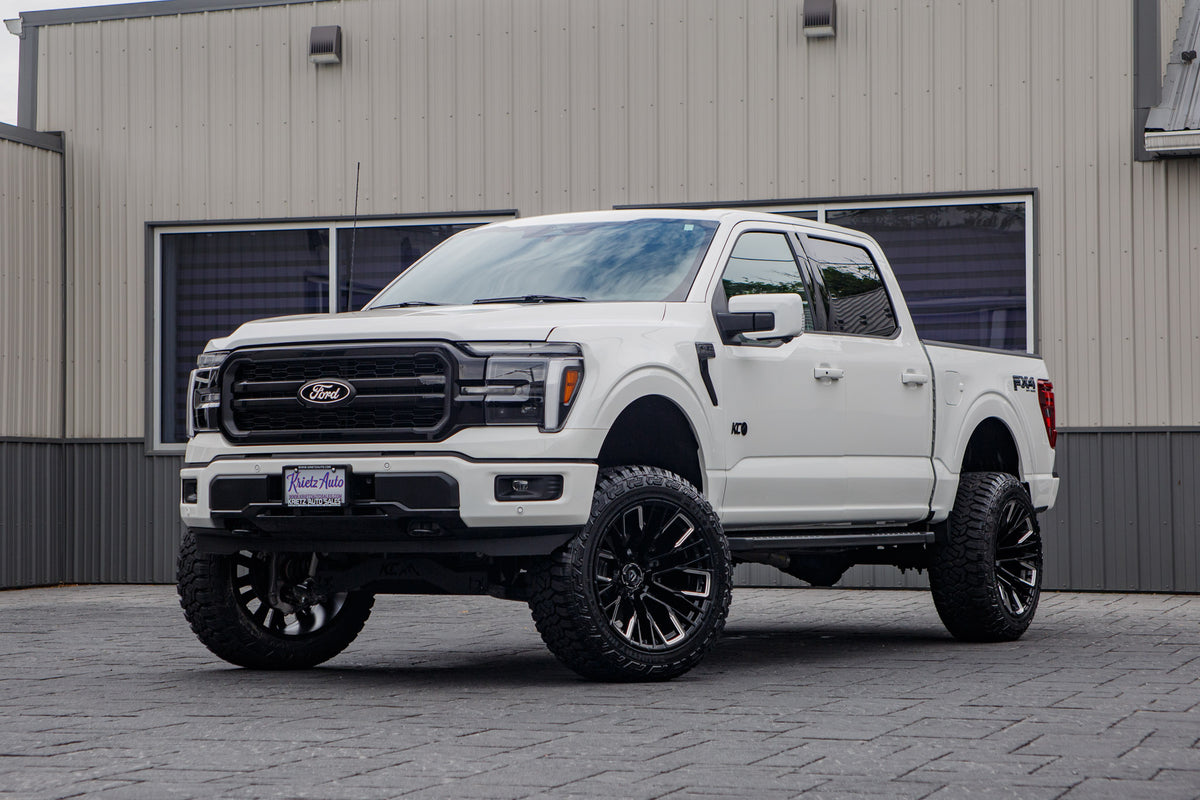 2026 Ford F-150 Lariat with a 6" Rough Country lift kit, 22x12 Fuel Rebar wheels, and 35" Fury Country Hunter R/T tires.