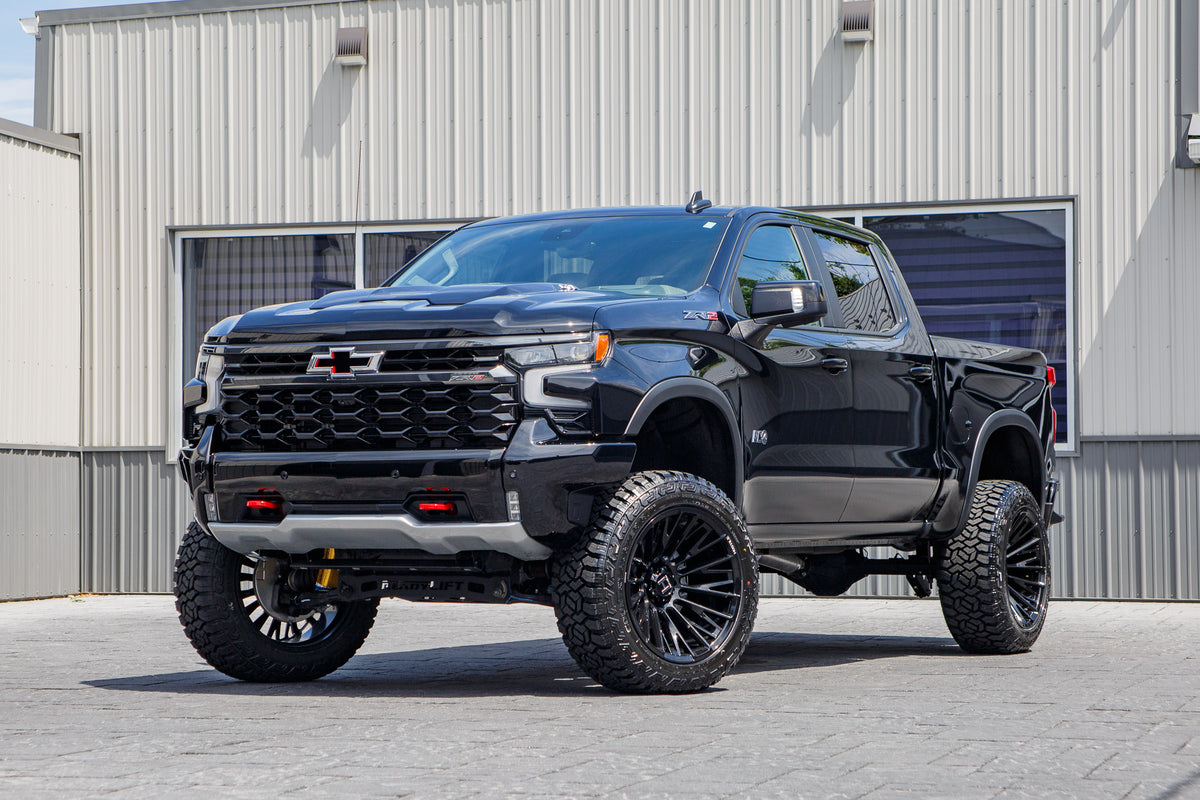 2026 Chevrolet Silverado 1500 ZR2 with a 4" ReadyLift lift kit, 22x12 Hostile Justice wheels, and 35" Fury Country Hunter R/T tires.