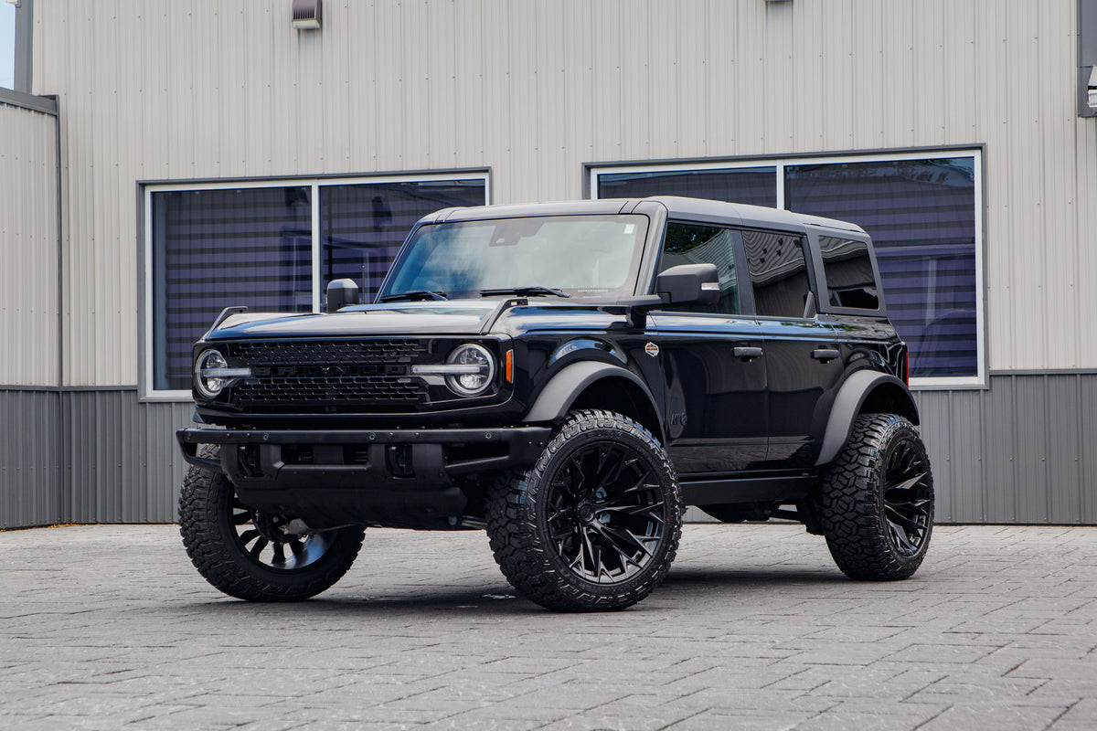 2024 Ford Bronco Wildtrak with a 2.25" Zone lift kit, 22x12 Fuel Flame wheels, and 35" Fury Country Hunter R/T tires.