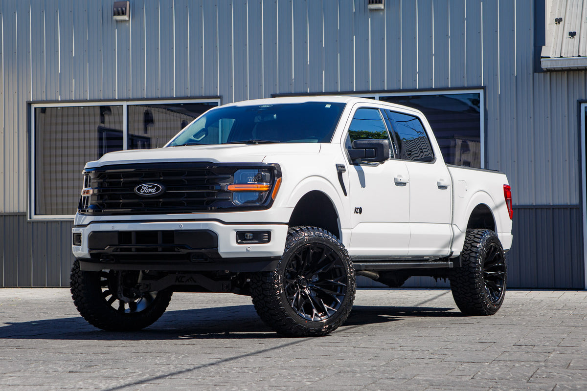 2024 Ford F-150 XLT with a 6" Rough Country lift kit, 22x12 Fuel Flame wheels, and 35" Fury Country Hunter R/T tires.