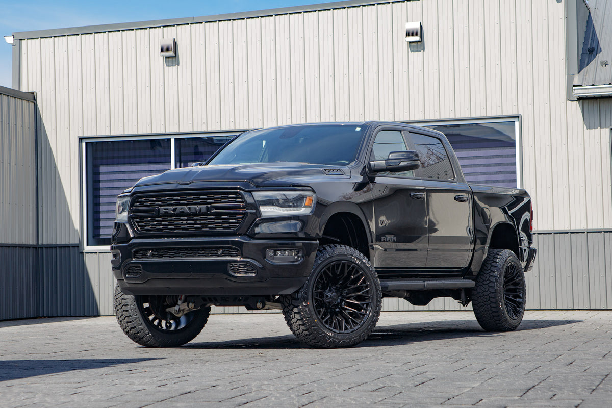 2023 Ram 1500 Lone Star with a 6" Rough Country lift kit, 22x12 Fuel Strike wheels, and 35" Fury Country Hunter R/T tires.