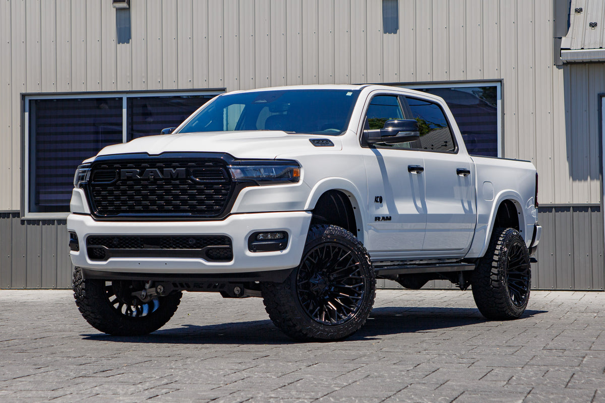 2025 Ram 1500 Lone Star with a 6" Rough Country lift kit, 22x12 Fuel Strike wheels, and 35" Fury Country Hunter R/T tires.