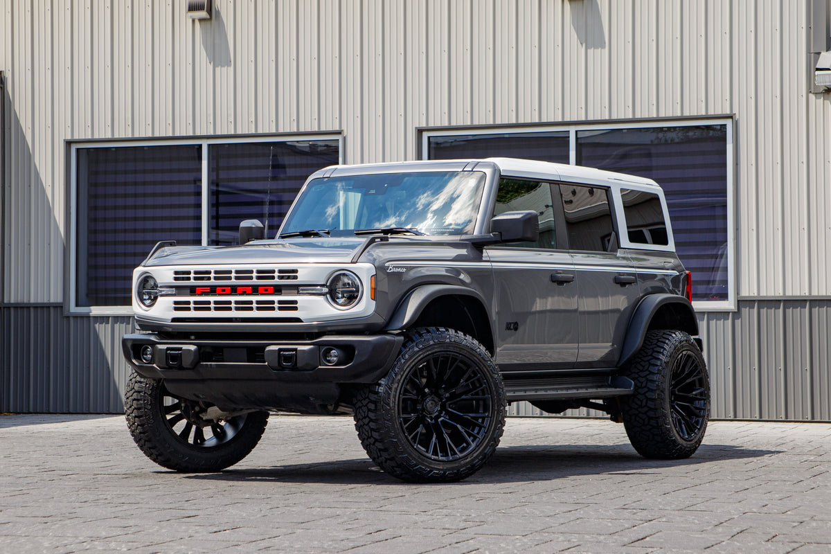 2025 Ford Bronco Heritage Edition with a 2.5" Rough Country lift kit, 22x12 Fuel Rebar wheels, and 35" Fury Country Hunter R/T tires.