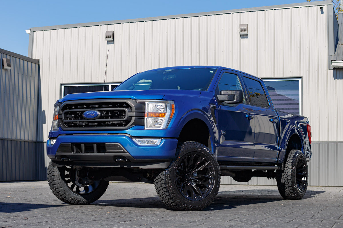 2022 Ford F-150 XL with a 6" Rough Country lift kit, 22x12 Fuel Flame wheels, and 35" Fury Country Hunter R/T tires.