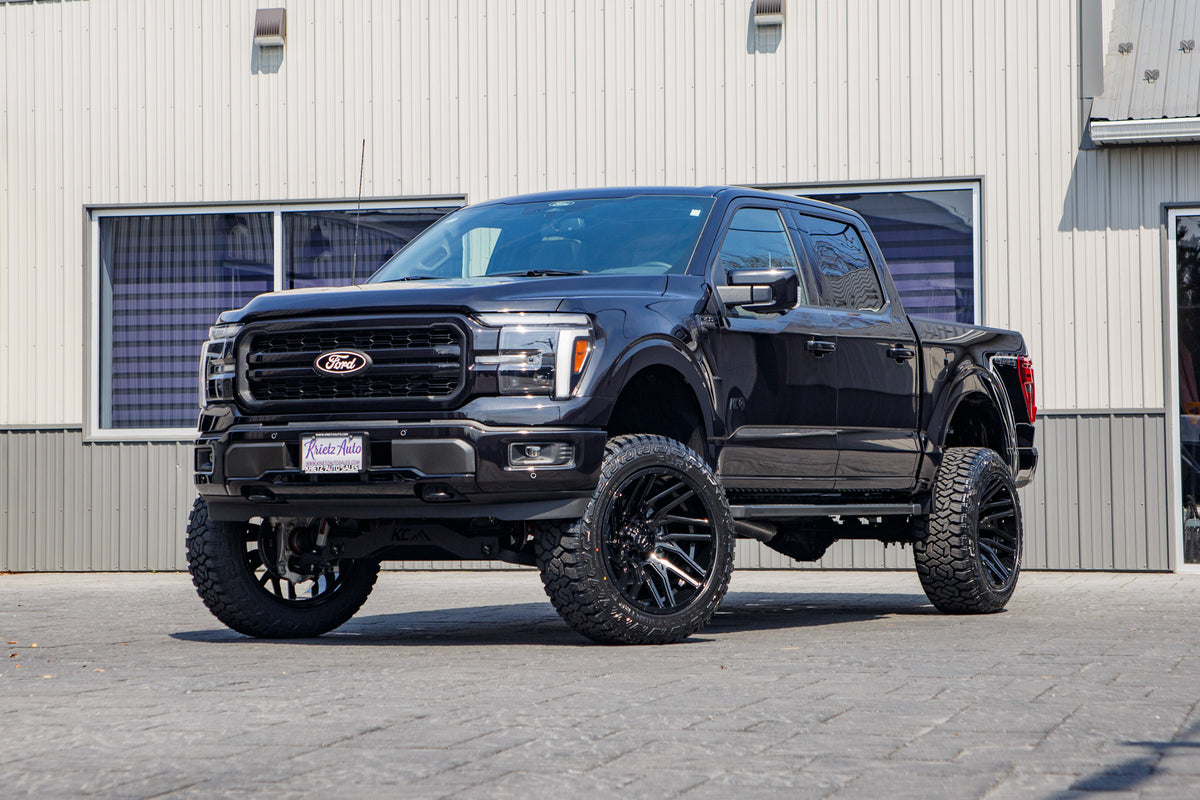 2025 Ford F-150 Lariat with a 6" Rough Country lift kit, 22x12 TIS 554B wheels, and 35" Fury Country Hunter R/T tires.