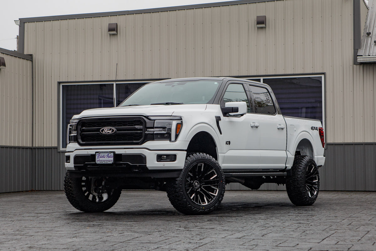 2025 Ford F-150 Lariat with a 6" Rough Country lift kit, 22x12 Fuel Rebar wheels, and 35" Fury Country Hunter R/T tires.