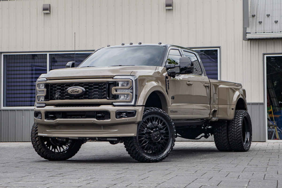 2026 Ford F-450 Super Duty Platinum with a 4" Wicked lift kit, 26x8.25 American Force Plague wheels, and 37" AMP Terrain Attack M/T A tires.