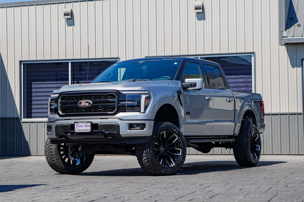 2025 Ford F-150 Lariat with a 6" Rough Country lift kit, 22x12 Fuel Rebar wheels, and 35" Fury Country Hunter R/T tires.