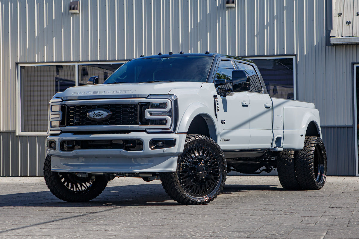 2026 Ford F-450 Super Duty Platinum with a 4" Wicked Lift kit, 26x8.25 American Force Business wheels, and 37" AMP Terrain Attack M/T A tires.