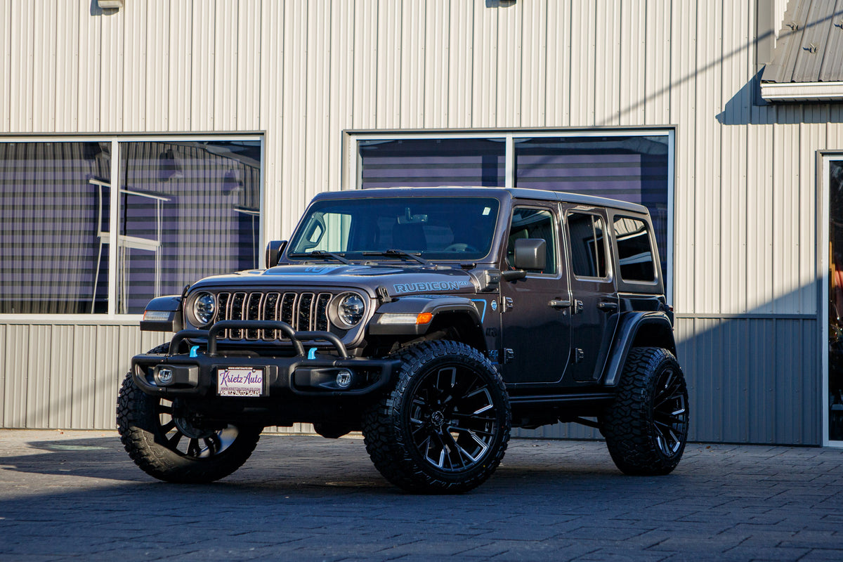 2023 Jeep Wrangler Rubicon 4XE with Jeep Stock suspension, 22x12 Fuel Rebar wheels, and Fury Country Hunter R/T tires.