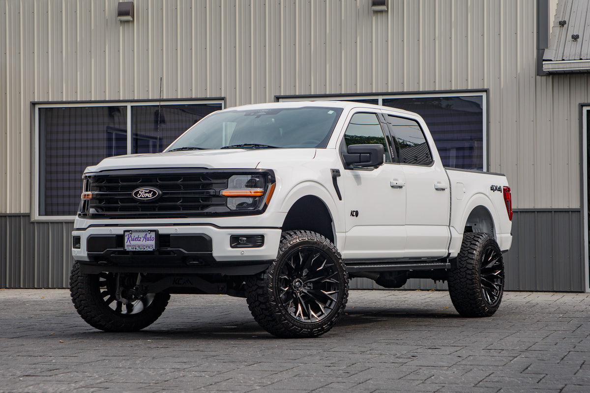2024 Ford F-150 XLT with a 6" Rough Country lift kit, 22x12 Fuel Flame wheels, and 35" Fury Country Hunter R/T tires.