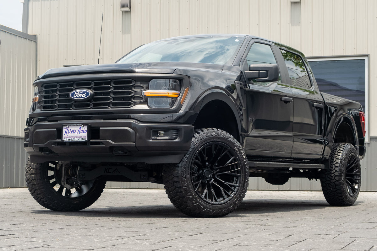 2025 Ford F-150 STX with a 6" Rough Country lift kit, 22x12 Fuel Rebar wheels, and 35" Fury Country Hunter R/T tires.