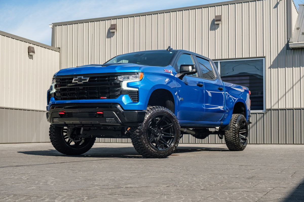 2024 Chevrolet Silverado 1500 LT Trail Boss with a 6" Rough Country lift kit, 22x12 Fuel Brawl wheels, and 35" Fury Country Hunter R/T tires.