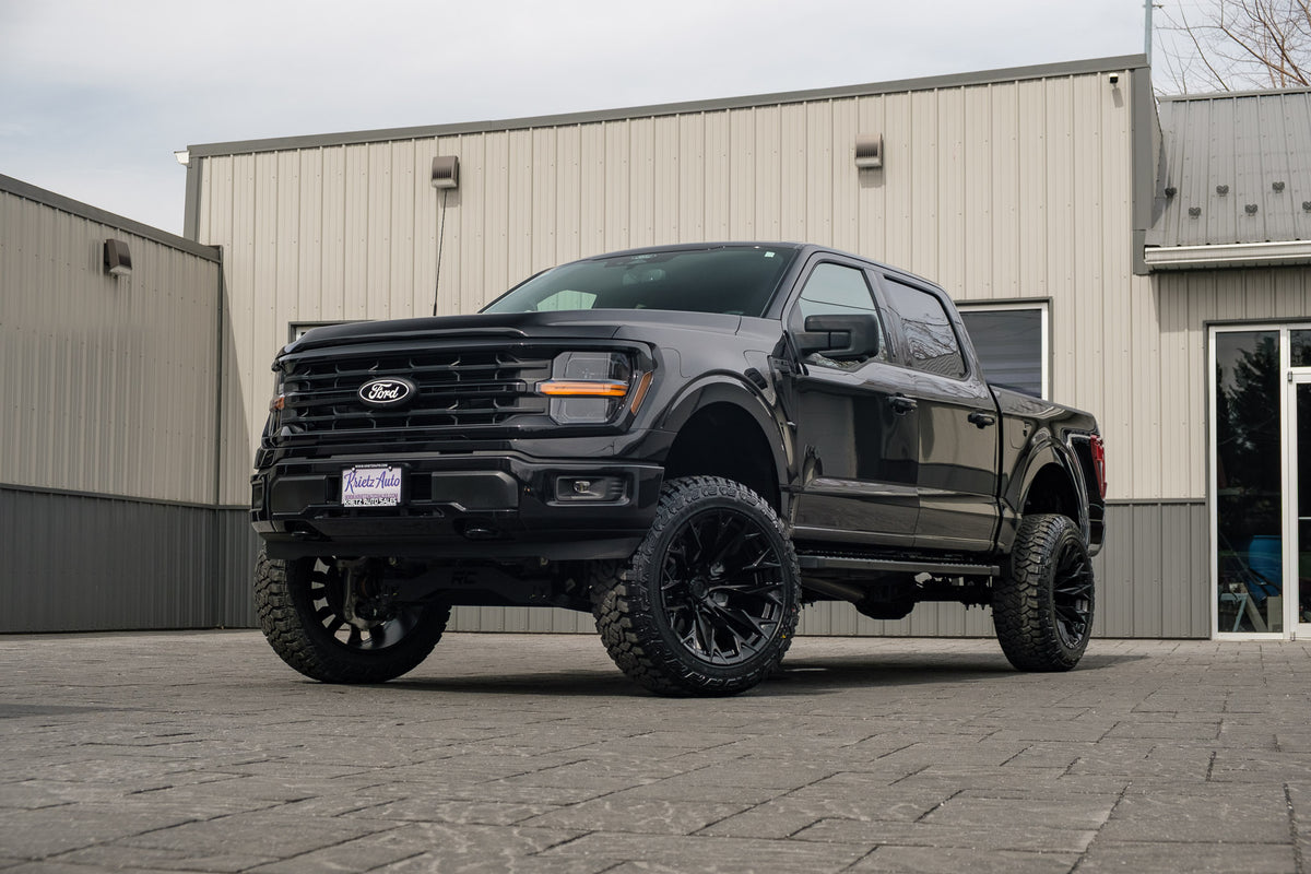 2024 Ford F-150 XLT with a 6" Rough Country lift kit, 22x12 Fuel Flame wheels, and 35" Fury Country Hunter R/T tires.