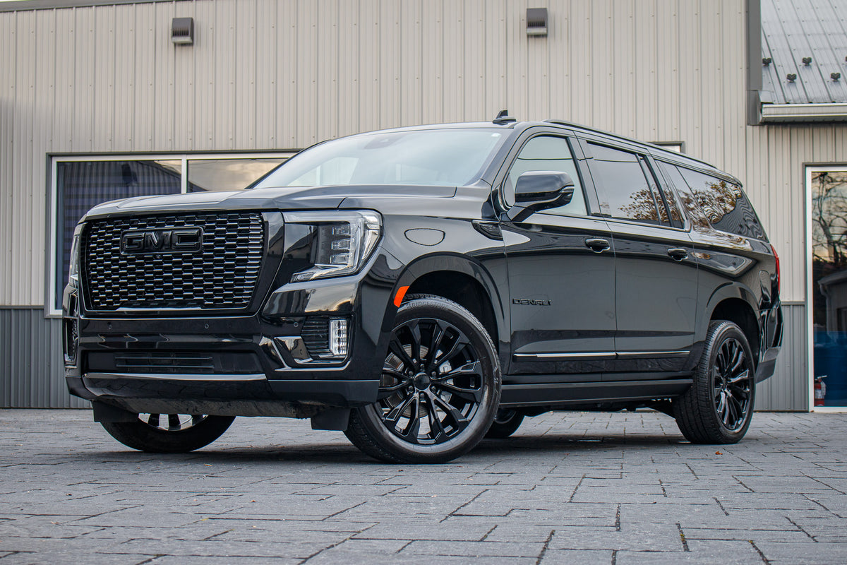 2023 GMC Yukon XL Denali with GMC Factory suspension, 22x9 GMC Stock, and Bridgestone Alenza tires.