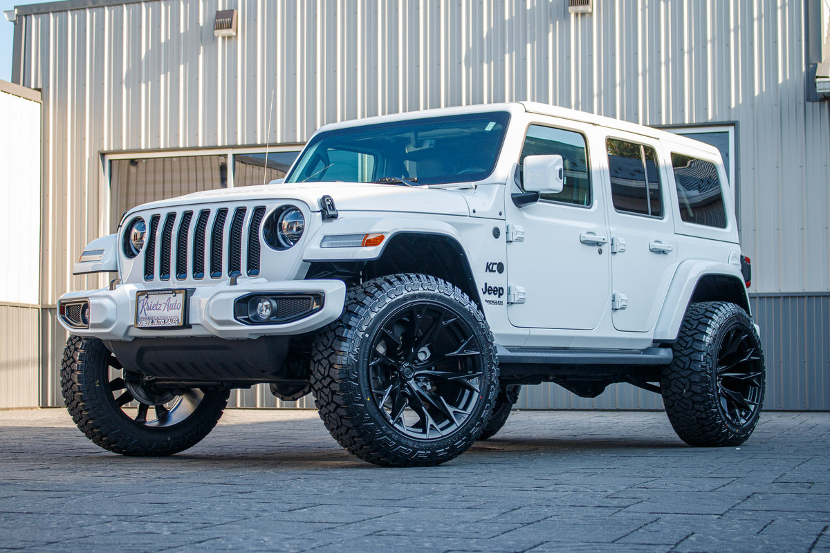 2021 Jeep Wrangler Unlimited Sahara with a 2.5" Rough Country lift kit, 22x12 Fuel Flame wheels, and 35" Fury Country Hunter R/T tires.
