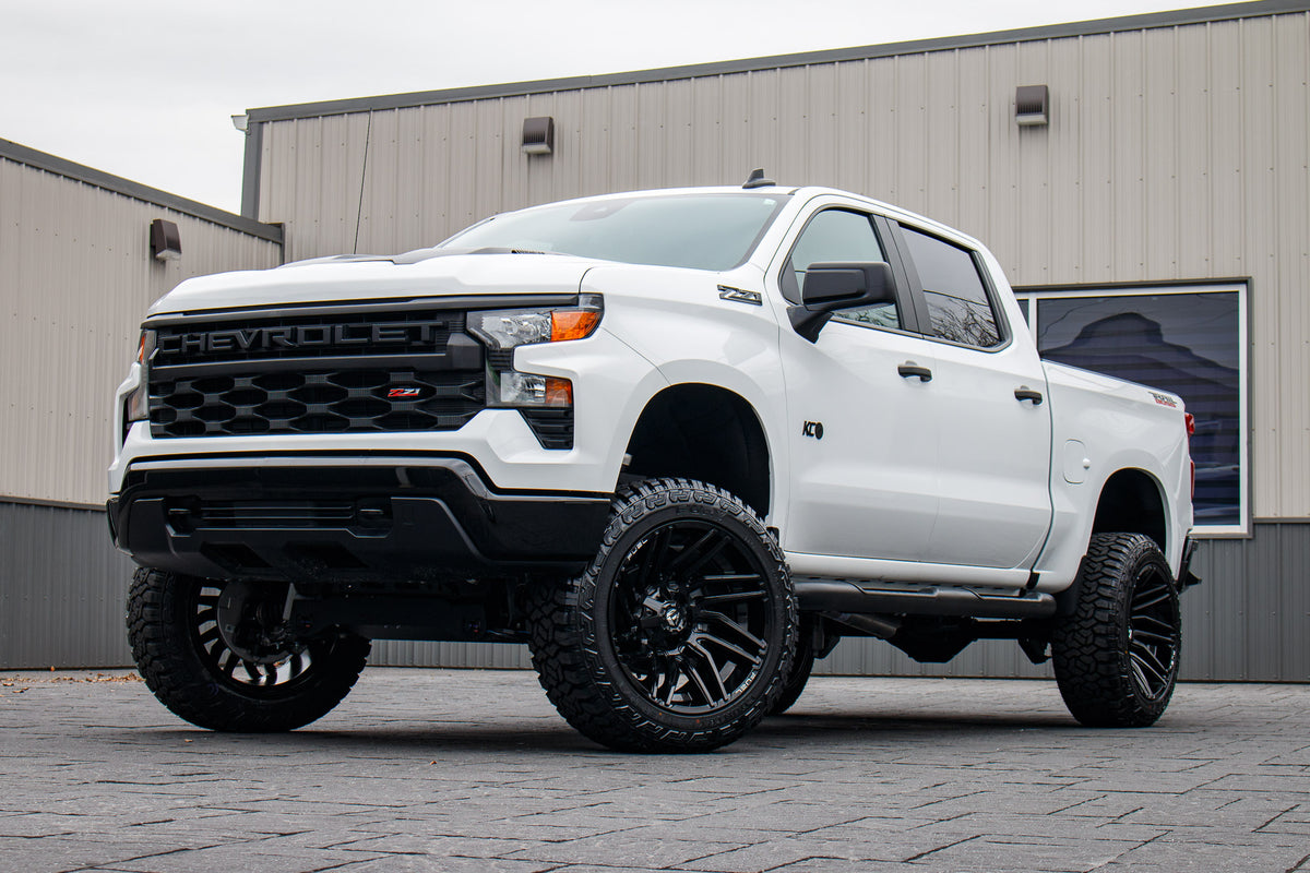 2025 Chevrolet Silverado 1500 Custom Trail Boss with a 6" Rough Country lift kit, 22x12 Fuel Typhoon wheels, and 35" Fury Country Hunter R/T tires.